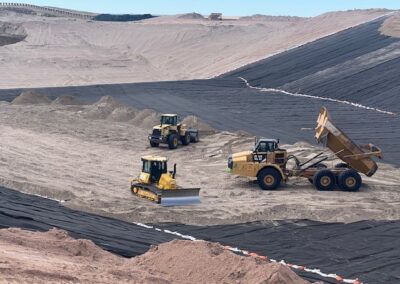 A finished cell construction at a landfill with equipment